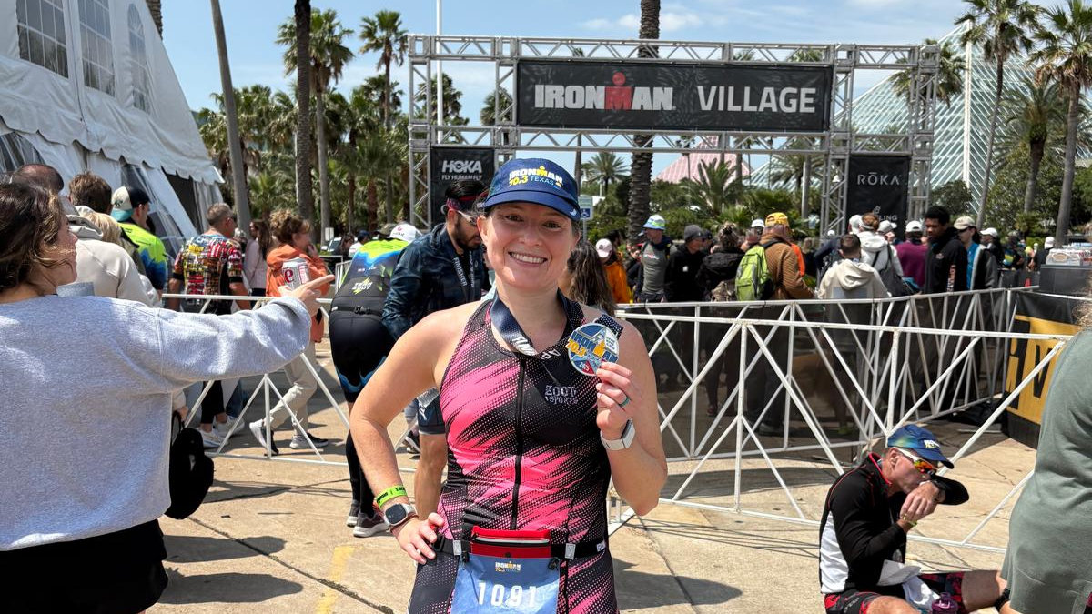Amanda Wachenfeld with medal after completing an Ironman.