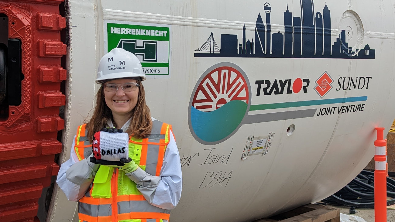 Amanda Wachenfeld on site in hi-vis and helmet.