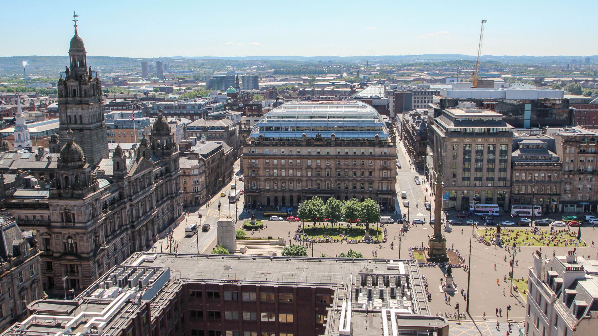 Glasgow city centre skyline viewed from above, illustrating local authority climate action, net zero planning and decarbonisation initiatives supported by Mott MacDonald and ClimateView.