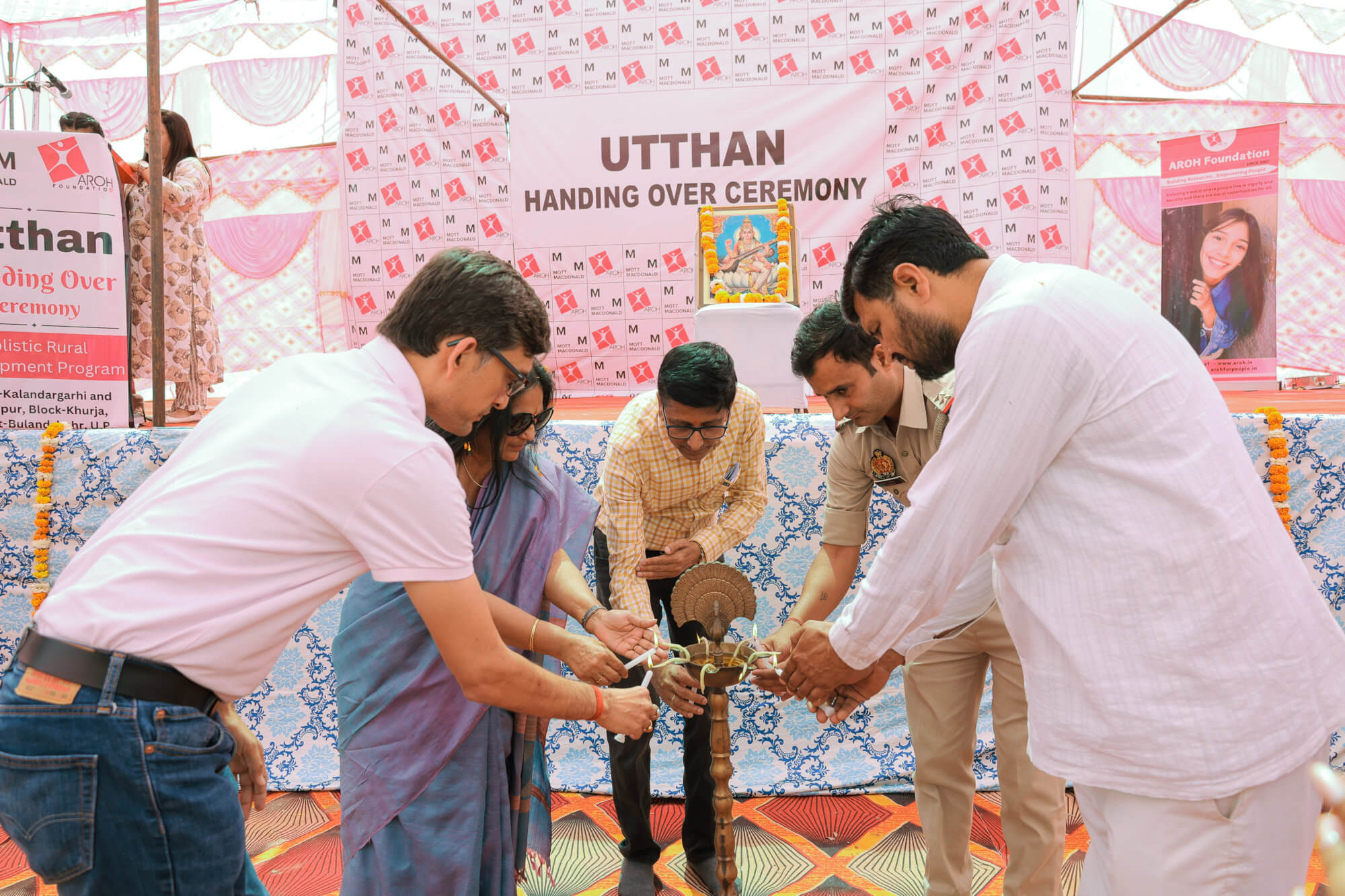 People lighting candles at the Utthan hadning over ceremony.