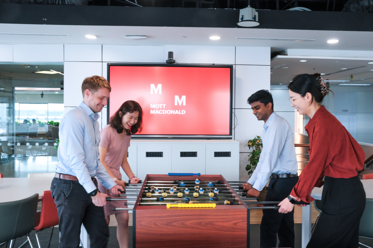 APNA early career professionals playing table football.