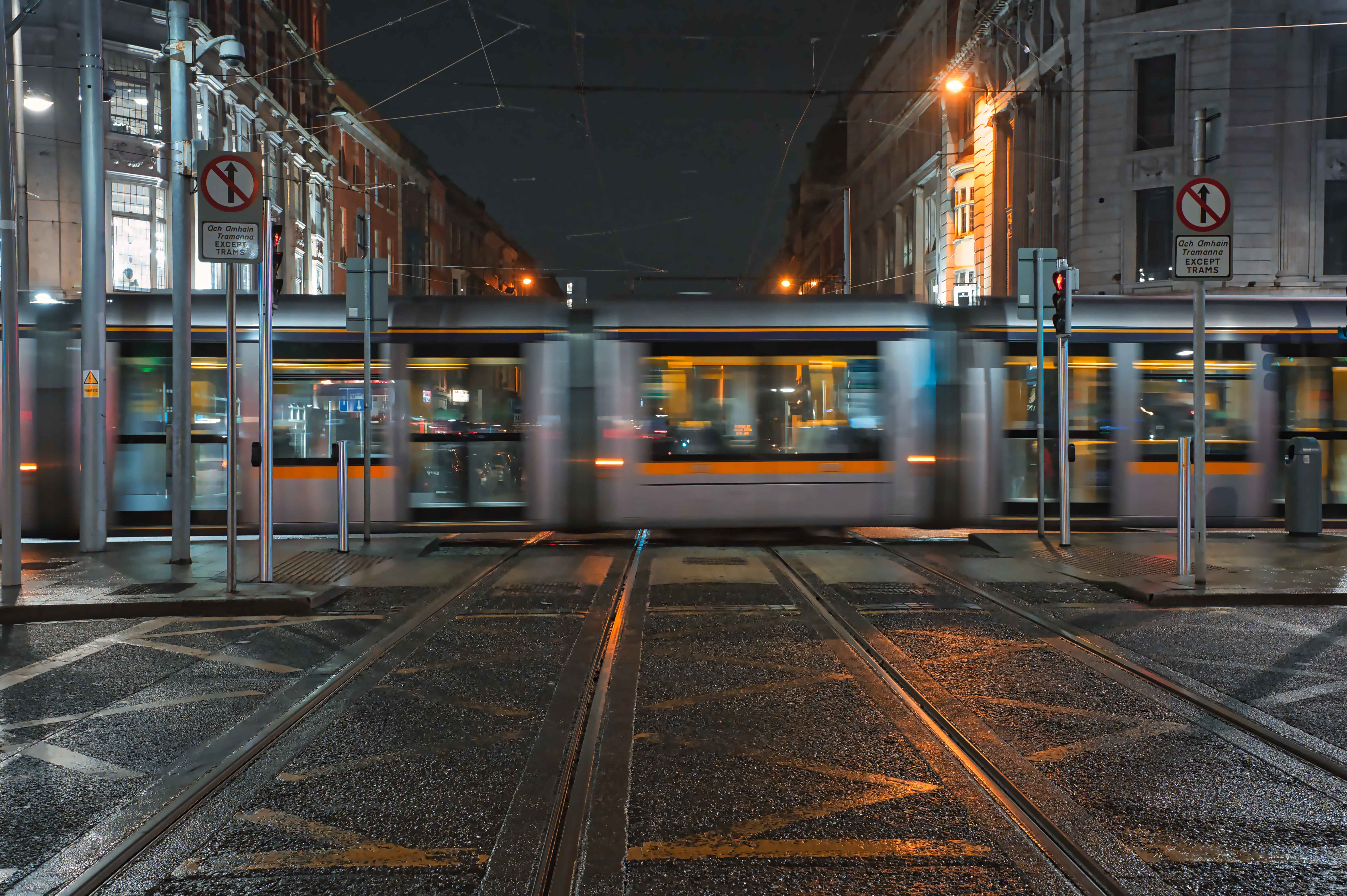 Train passing through city at night