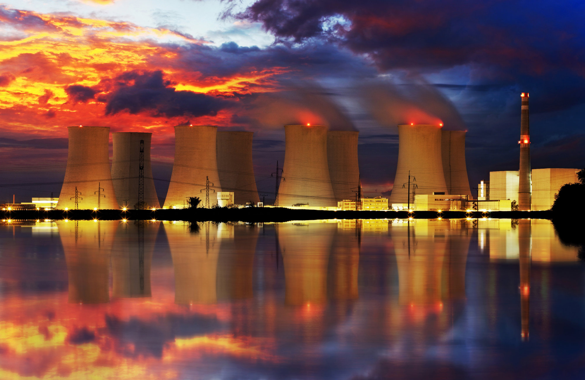 Nuclear plant cooling towers at night.
