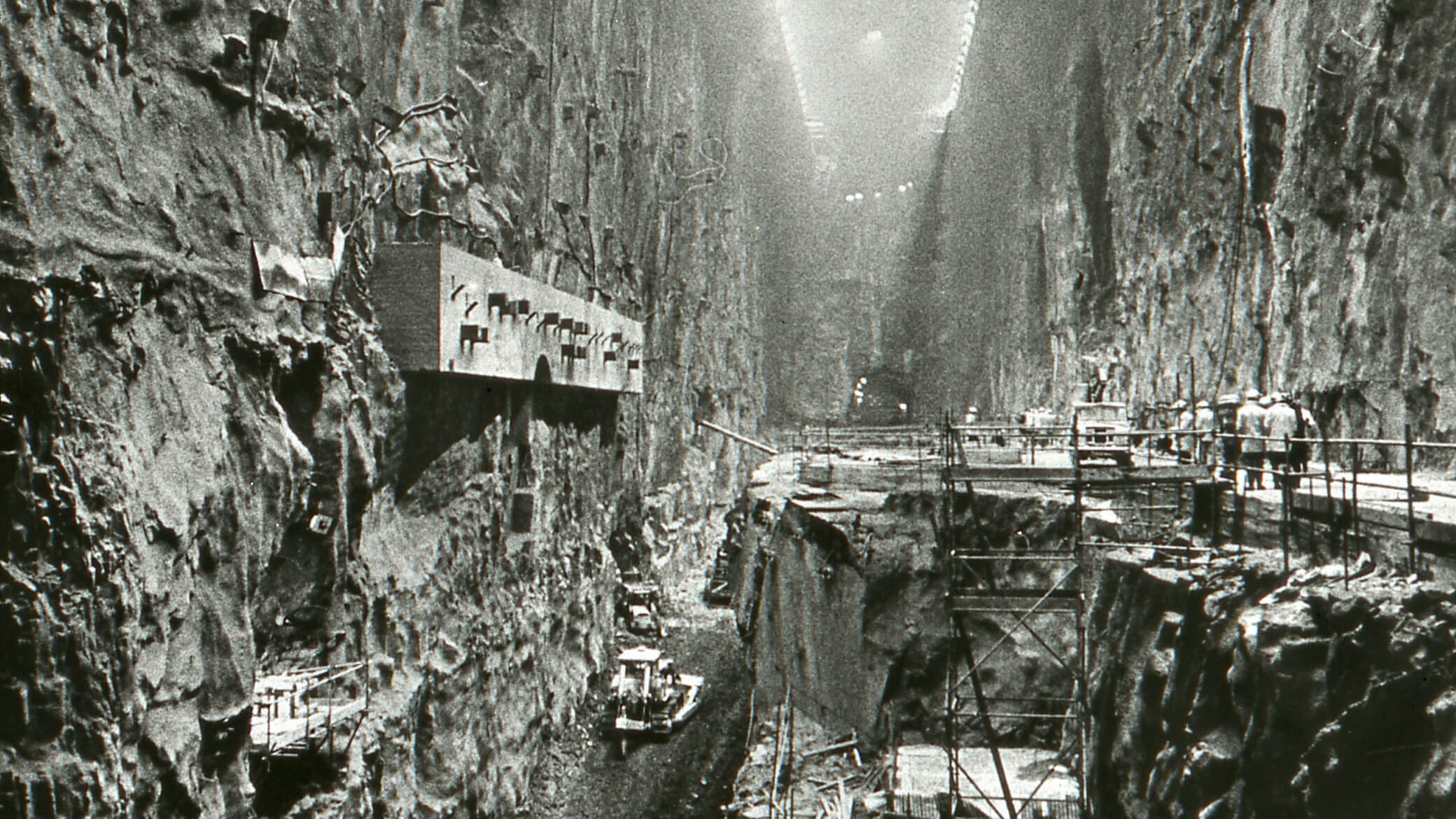 Black and white image of a cavern being excavated during dam construction.