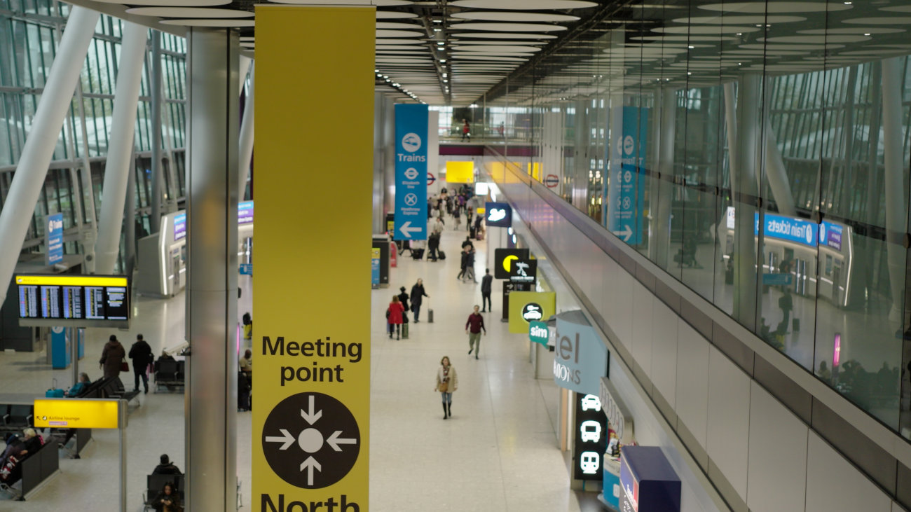 Sign marking a meeting point at Heathrow airport.