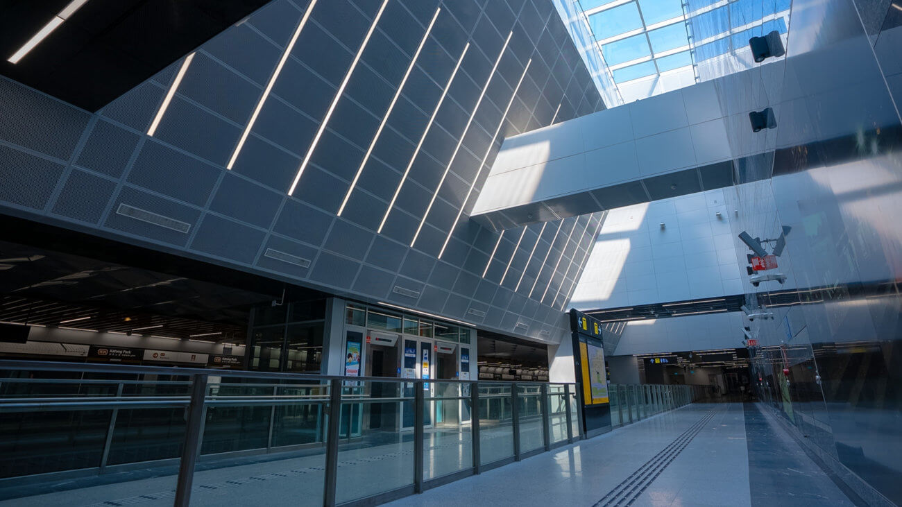 A station concourse with divided walkways.