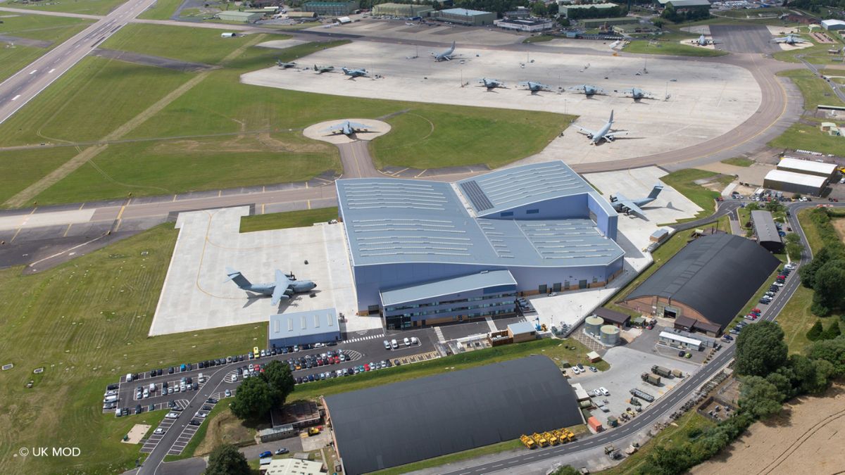Aerial view of a military air base illustrating collaborative defence infrastructure, aligned with UK government targets and systems thinking in modern defence delivery