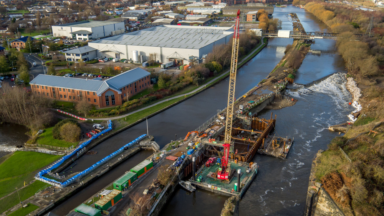 Crane and engineering works on a river.