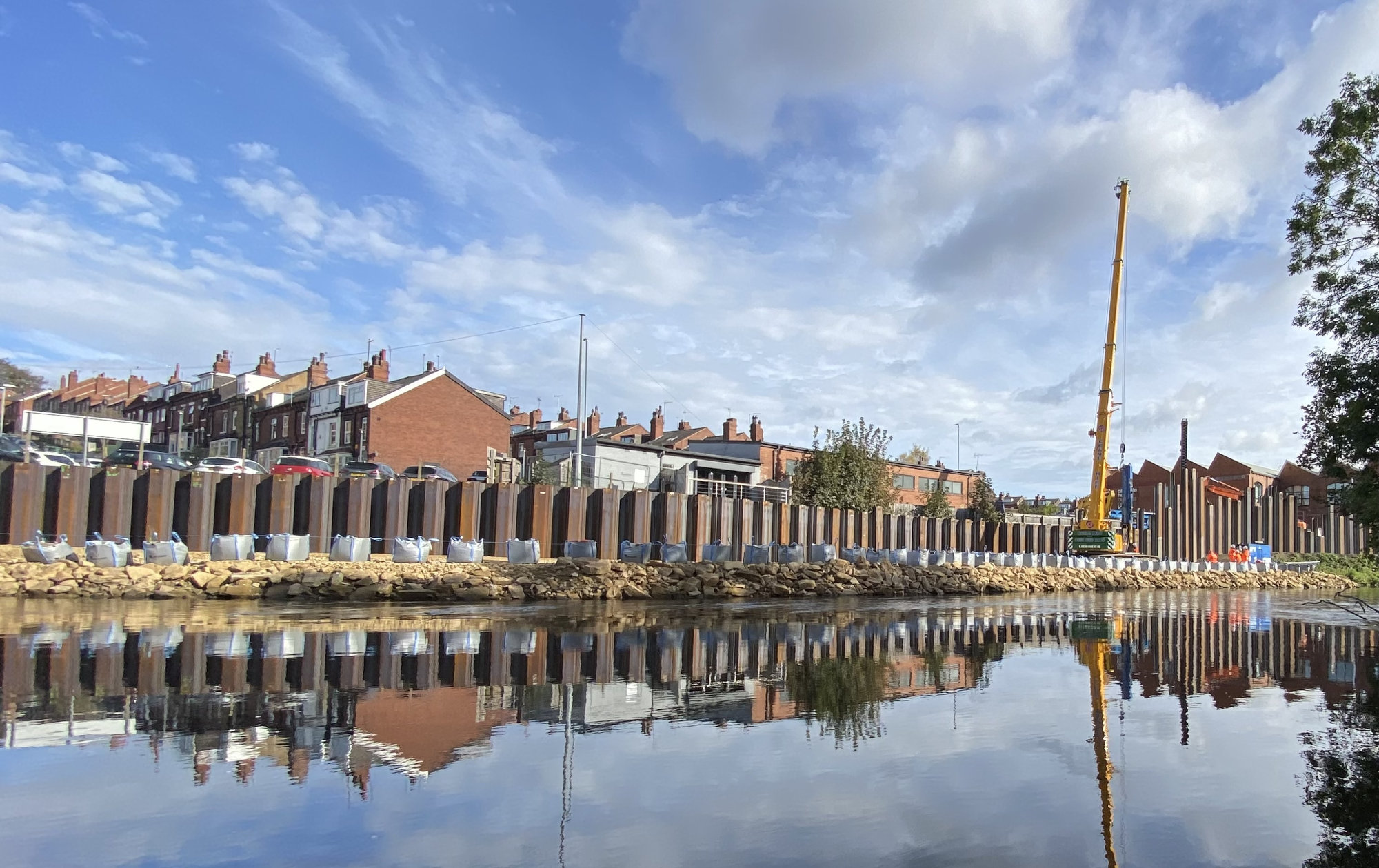 Flood defence barriers by a river.