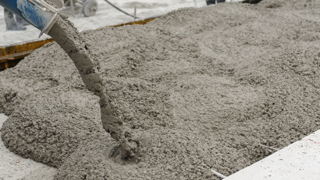 Wet concrete being poured