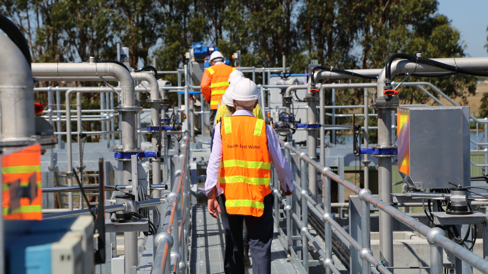 Engineer in hi-vis at a water treatment plant.