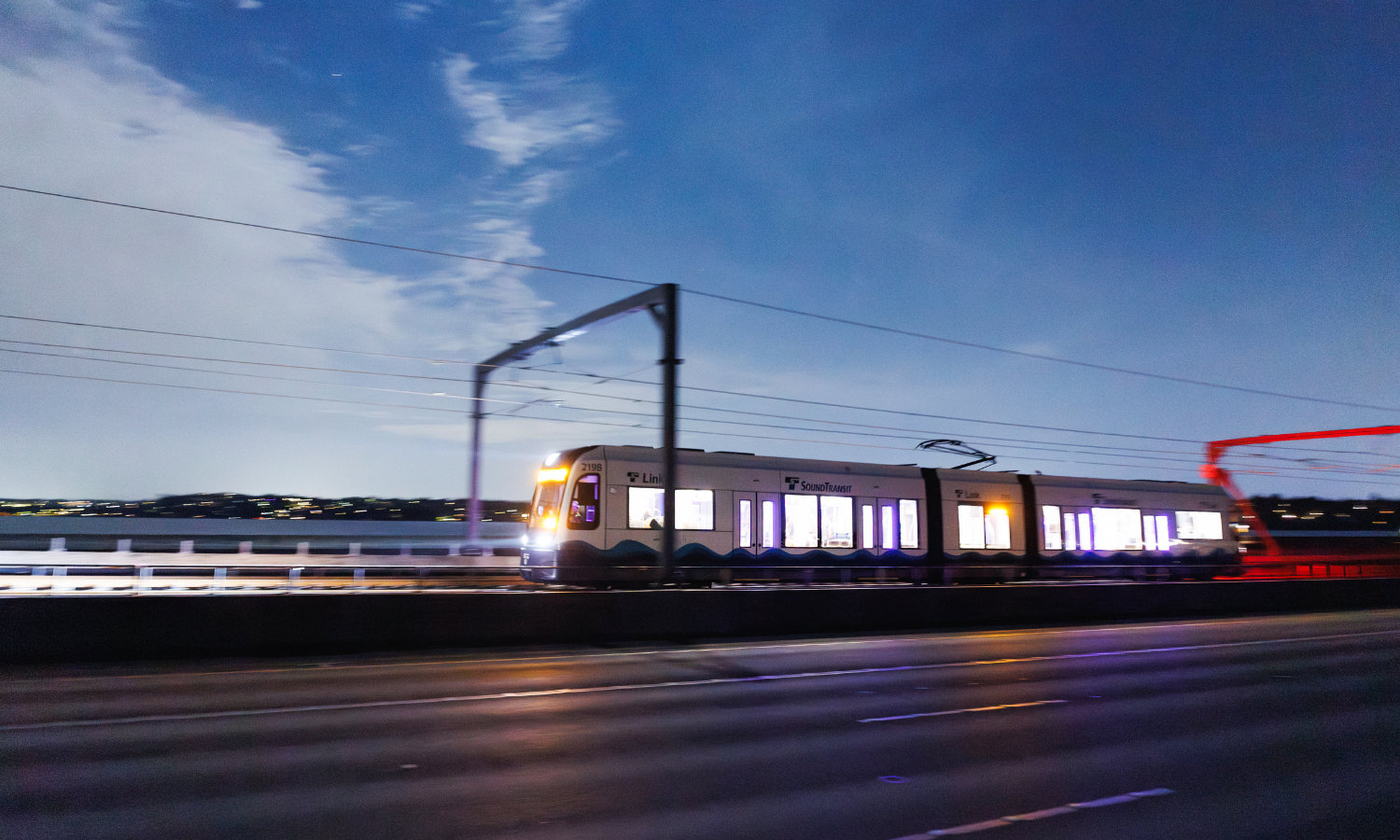Train running along the Sound Transit East Link Extension in early evening.