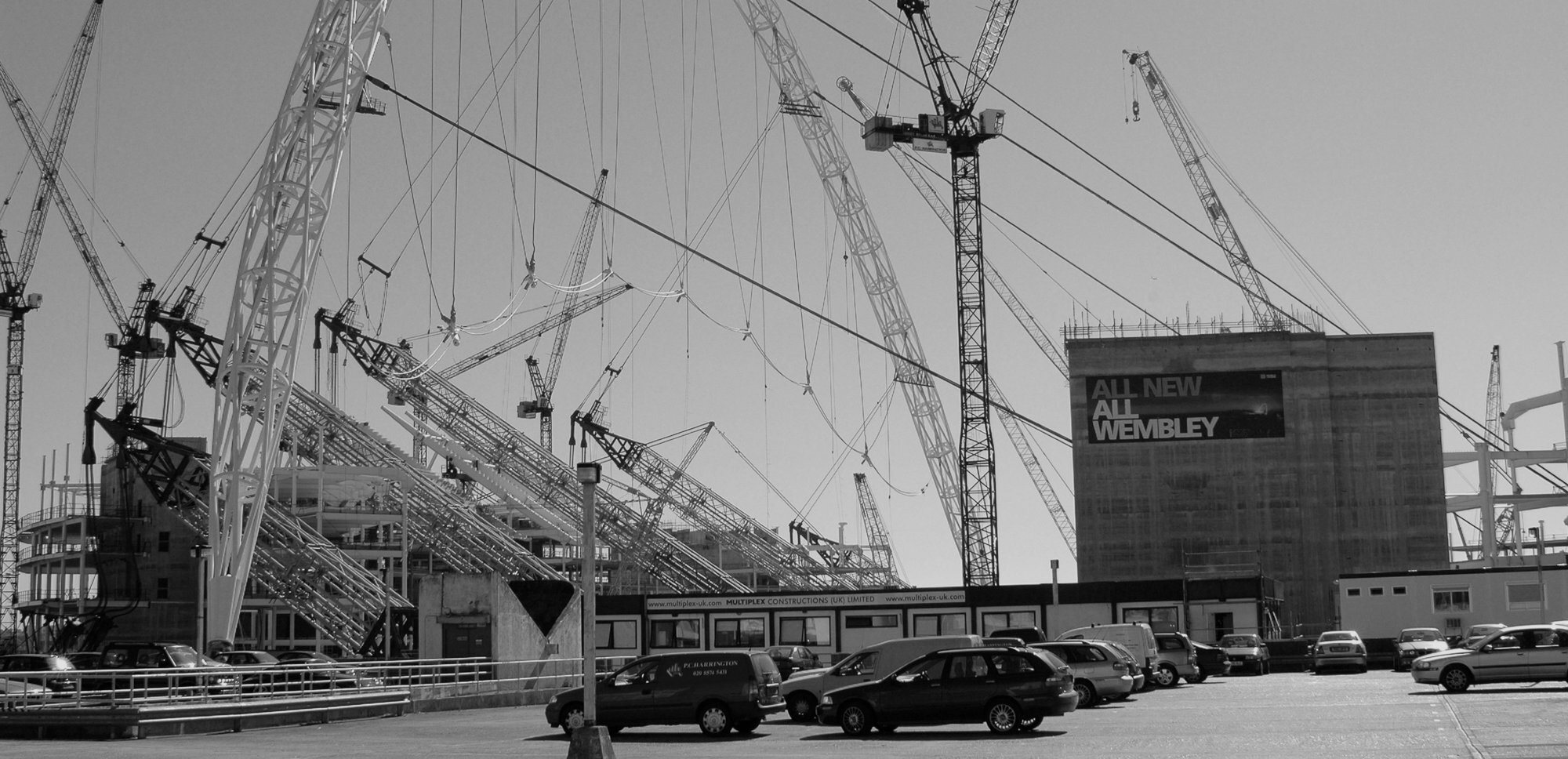 Black and white image of Wembley Stadium arch being erected.